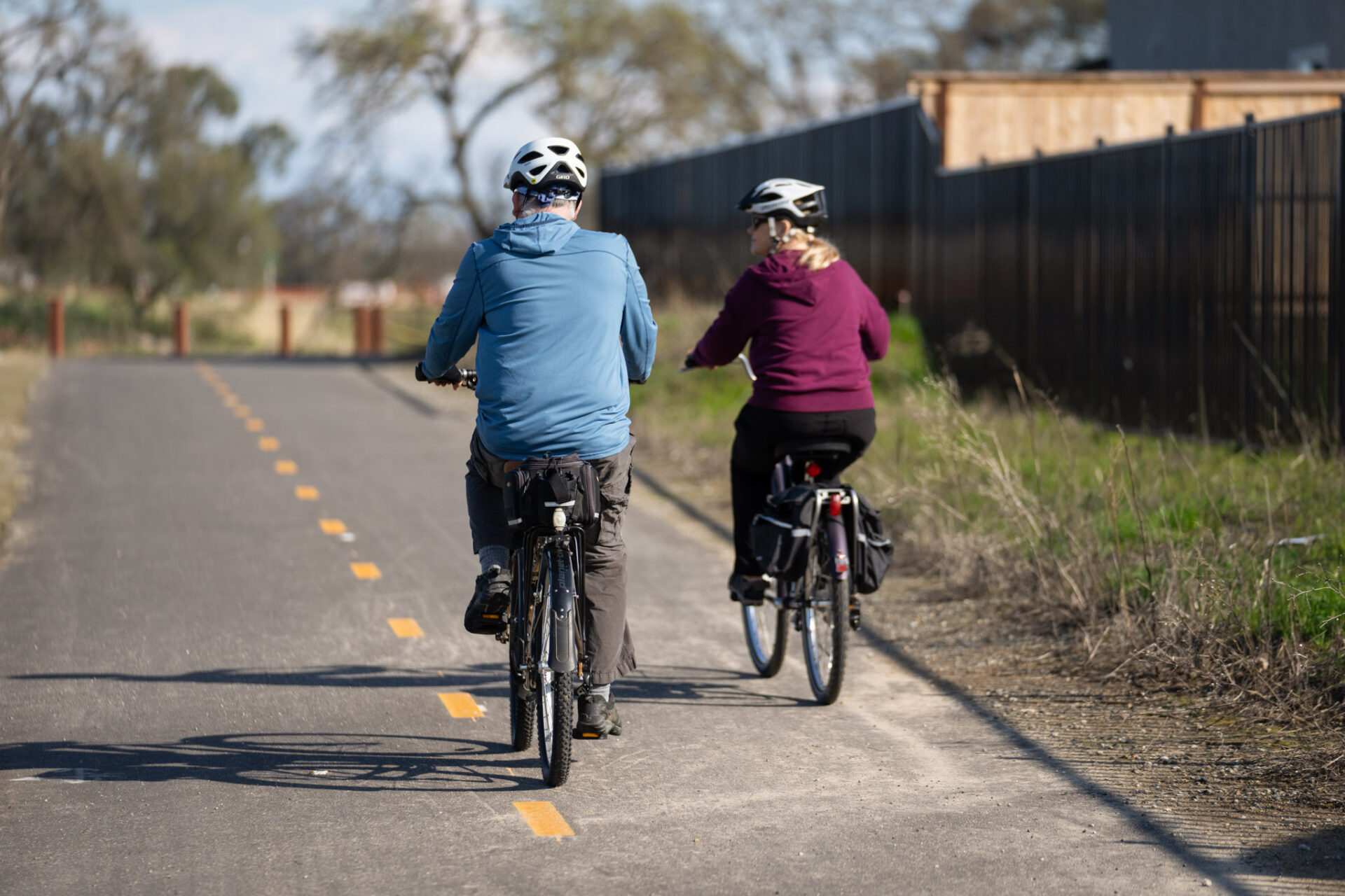 couple bike riding on trial by Winding Creek
